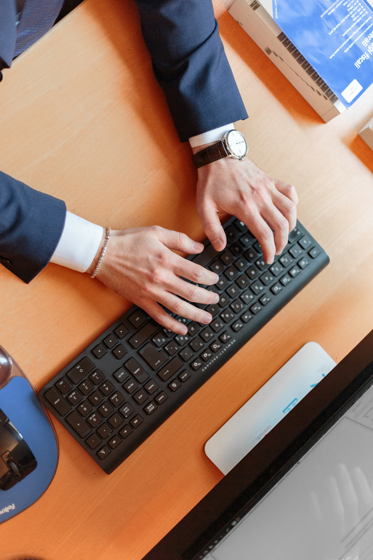 Man Typing on Computer Keyboard